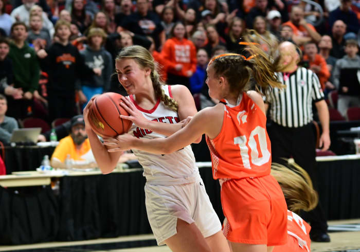 Estherville Lincoln Central's Jasey Anderson fights for a loose ball with Solon's Mia Stahle during the Class 3A state championship game at Wells Fargo Arena in Des Moines. (Photo by Ryan Timmerman)